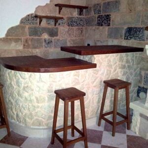 built-in kitchen with stone-covered counter