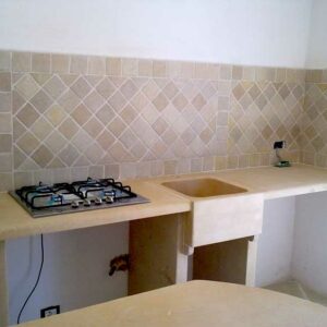 Masonry kitchen with stone majolica
